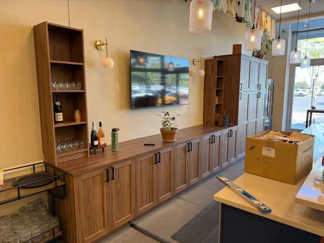 Built-in wall cabinets and shelving around a mounted TV
