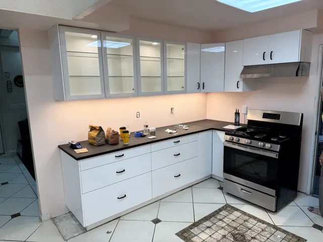 Upper glass cabinets, range hood and under-cabinet lighting