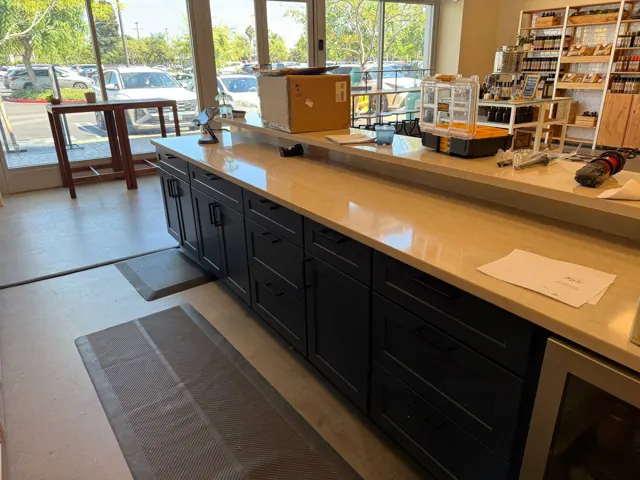 Navy island cabinets with a quartz top