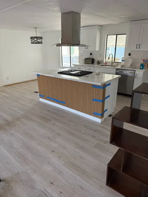 Kitchen island with slatted panels, mid-install